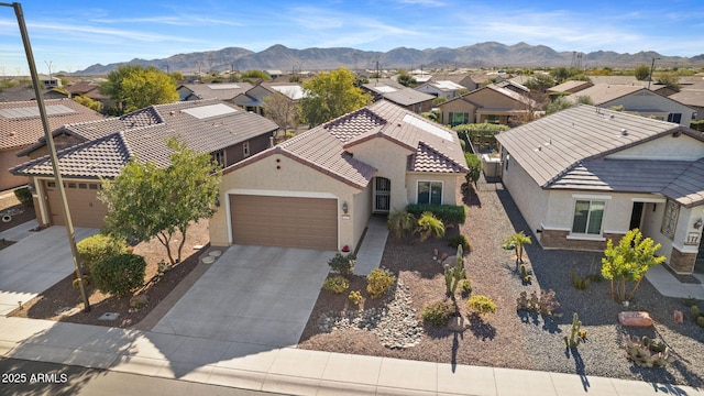 aerial view featuring a mountain view and a residential view