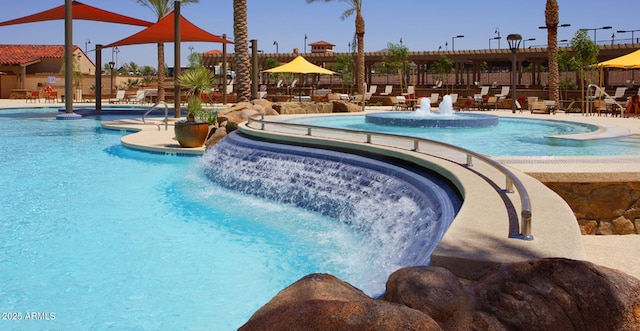 pool featuring a patio and fence