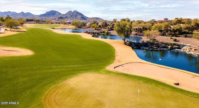 view of home's community featuring view of golf course and a mountain view