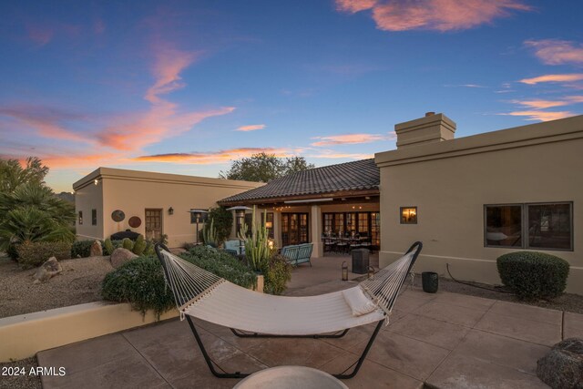 view of patio terrace at dusk