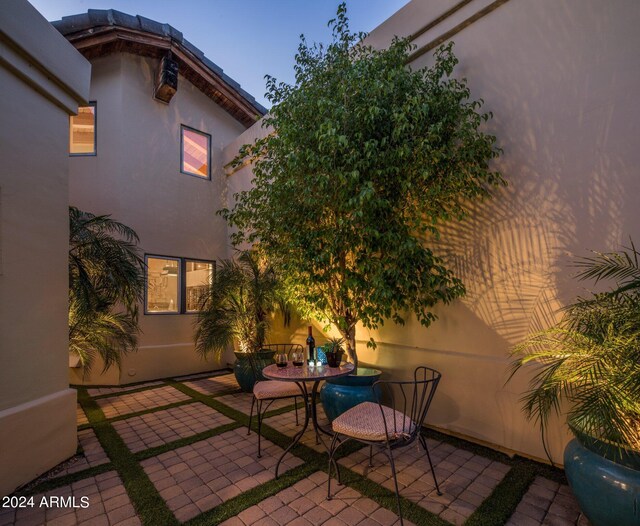 view of patio terrace at dusk