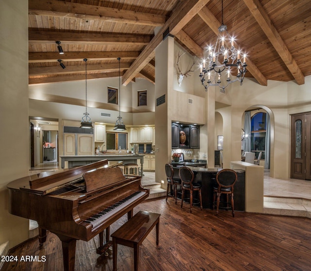 interior space featuring beamed ceiling, arched walkways, wood-type flooring, wooden ceiling, and a notable chandelier