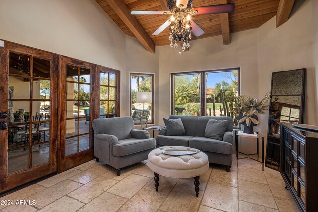 living room with beamed ceiling, wooden ceiling, and a healthy amount of sunlight