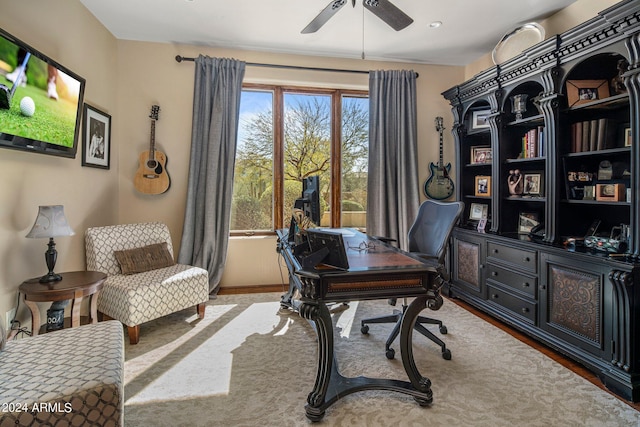 office featuring ceiling fan and baseboards