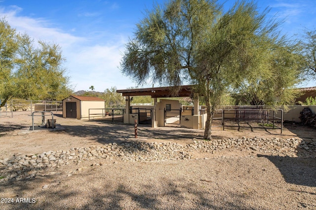 view of yard featuring an exterior structure and an outdoor structure