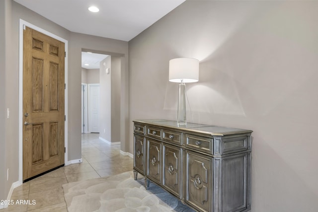 corridor featuring light tile patterned flooring