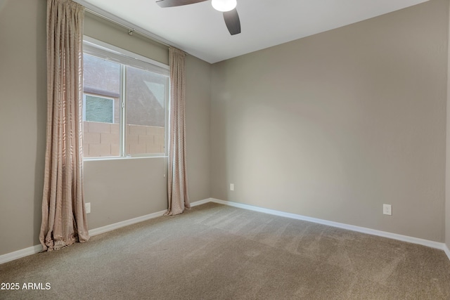 unfurnished room with carpet and ceiling fan