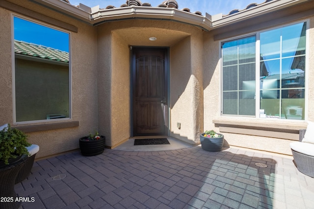 property entrance with a patio area