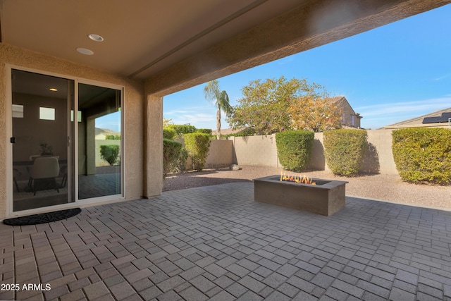 view of patio / terrace featuring a fire pit