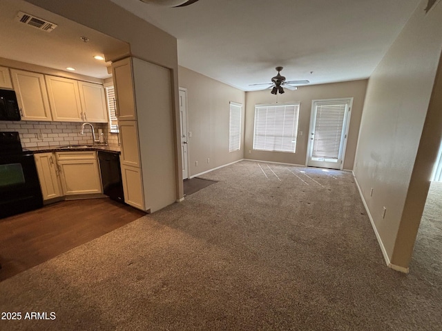 1825 W Ray Rd Unit 2082, Chandler, AZ 85224 - kitchen with black appliances, dark carpet, a ceiling fan, and decorative backsplash