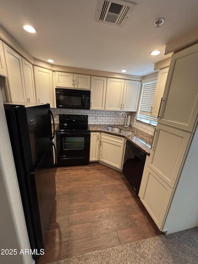 1825 W Ray Rd Unit 2082, Chandler, AZ 85224 - kitchen featuring black appliances, recessed lighting, backsplash, dark wood-type flooring, and white cabinetry