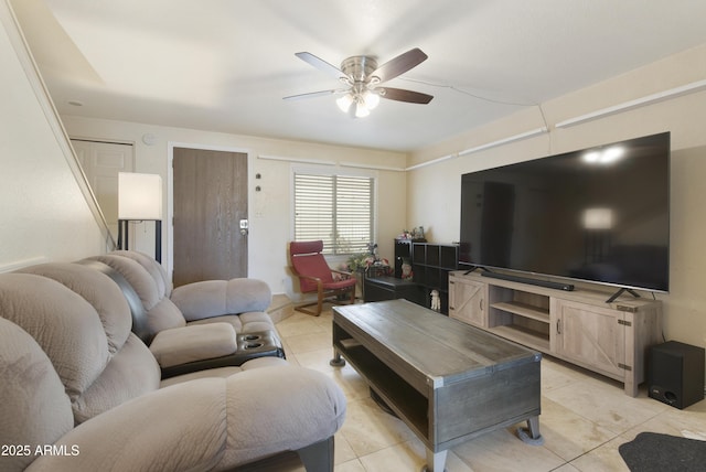 tiled living room with ceiling fan