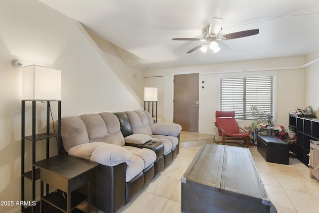 living room featuring light tile patterned floors and ceiling fan