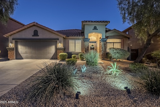 view of front of property with a garage