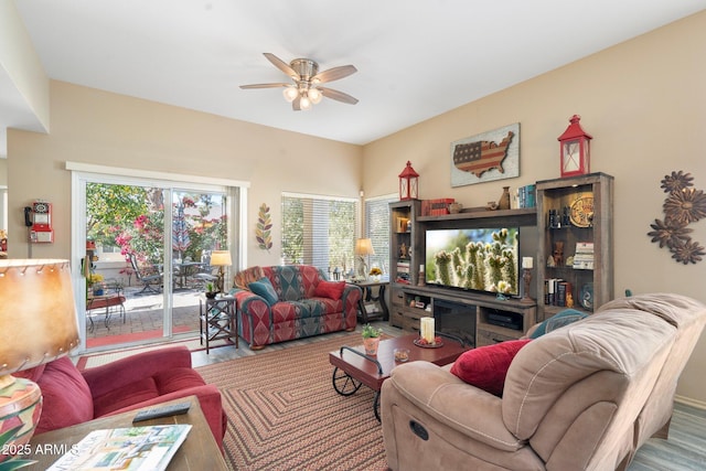 living area with ceiling fan and wood finished floors