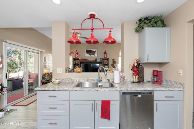 kitchen with dishwasher, recessed lighting, light wood-type flooring, and a sink