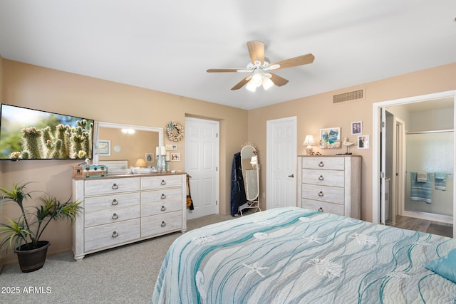 bedroom featuring visible vents, a ceiling fan, and carpet floors