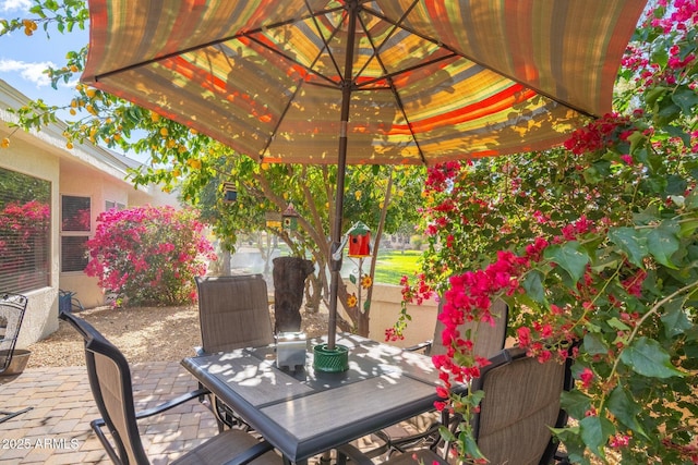 view of patio featuring outdoor dining area