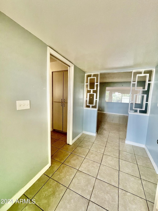 5522 E Colby St, Mesa, AZ 85205 - corridor featuring light tile patterned flooring and baseboards