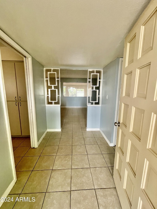 5522 E Colby St, Mesa, AZ 85205 - corridor featuring light tile patterned floors and baseboards