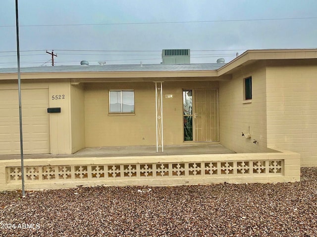 property entrance featuring cooling unit