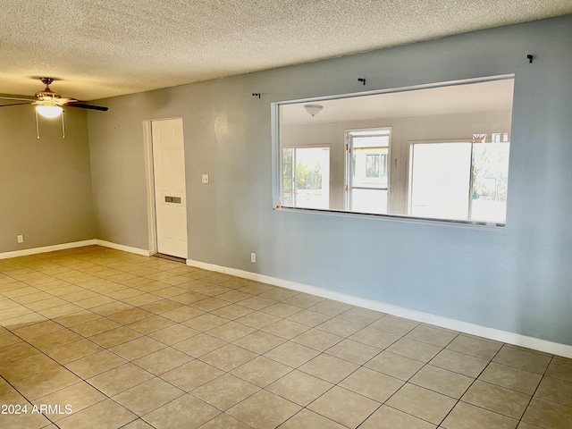 5522 E Colby St, Mesa, AZ 85205 - unfurnished room featuring a textured ceiling, light tile patterned flooring, and ceiling fan