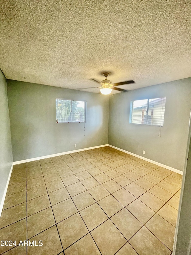 5522 E Colby St, Mesa, AZ 85205 - unfurnished room with light tile patterned floors, ceiling fan, and a textured ceiling