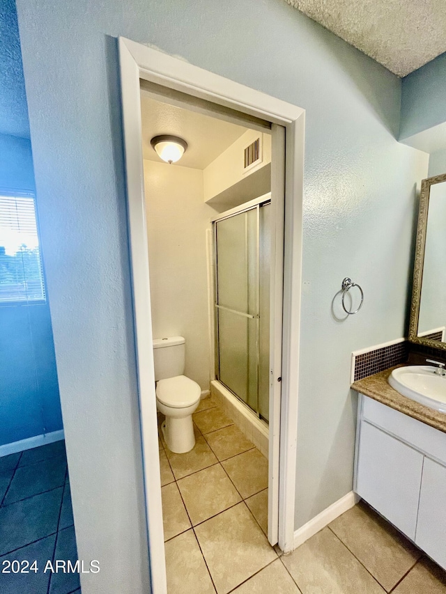 5522 E Colby St, Mesa, AZ 85205 - bathroom featuring a shower stall, vanity, tile patterned floors, and a textured ceiling