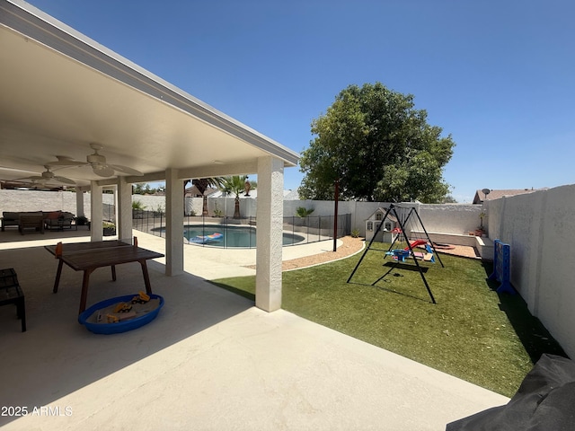 10029 S 44th St, Phoenix, AZ 85044 - fenced backyard featuring a ceiling fan, a patio area, outdoor lounge area, and a playground