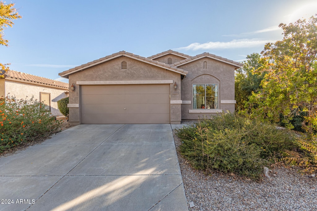 view of front of property with a garage