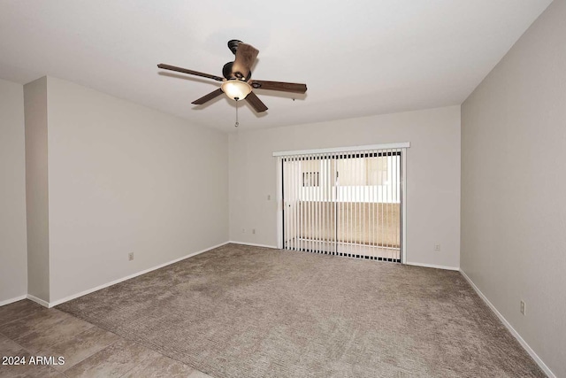 carpeted empty room with ceiling fan