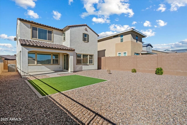 back of property featuring a patio