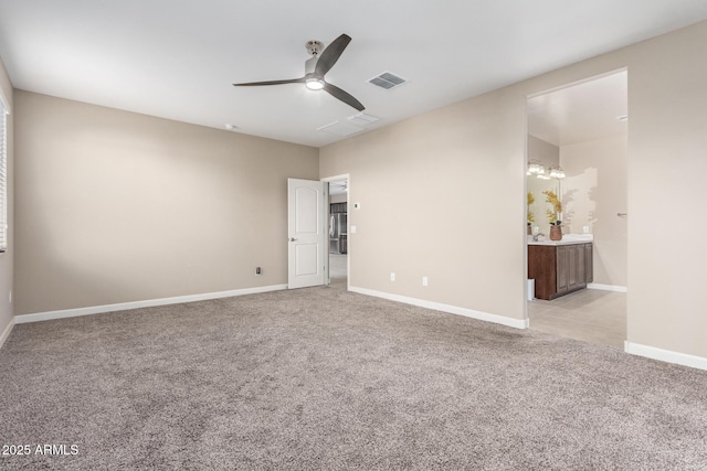 carpeted empty room featuring ceiling fan