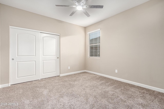 unfurnished bedroom featuring carpet flooring, ceiling fan, and a closet