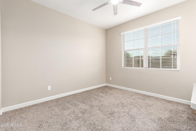 spare room with carpet flooring and ceiling fan