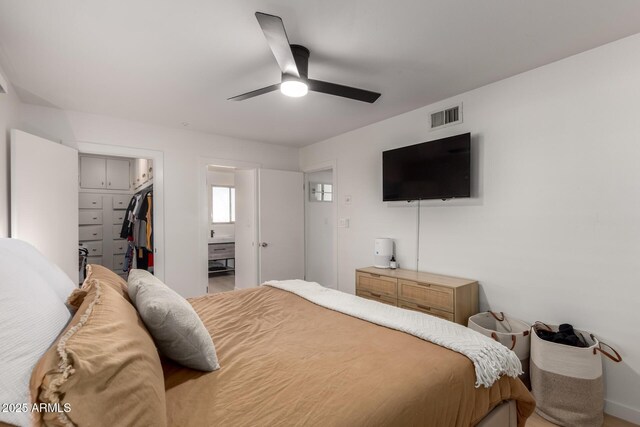 7811 N 32nd Ave, Phoenix, AZ 85051 - bedroom featuring a walk in closet, visible vents, a closet, and ceiling fan