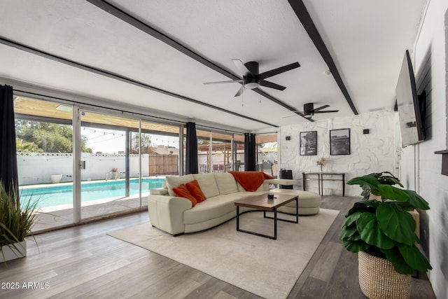 7811 N 32nd Ave, Phoenix, AZ 85051 - living room featuring beam ceiling, a sunroom, ceiling fan, and wood finished floors