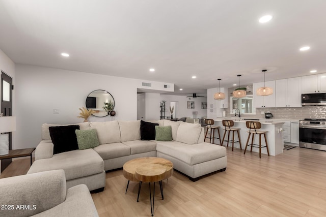 7811 N 32nd Ave, Phoenix, AZ 85051 - living area with recessed lighting, light wood-type flooring, and visible vents