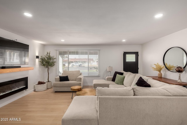 7811 N 32nd Ave, Phoenix, AZ 85051 - living area featuring a glass covered fireplace, light wood-style flooring, and recessed lighting