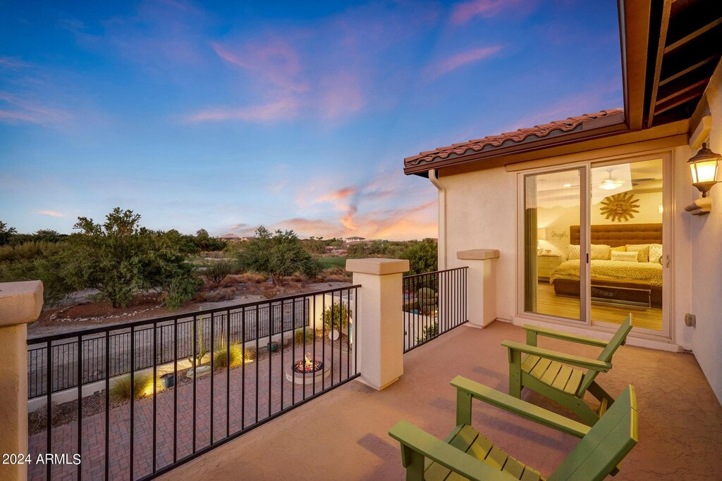 view of balcony at dusk