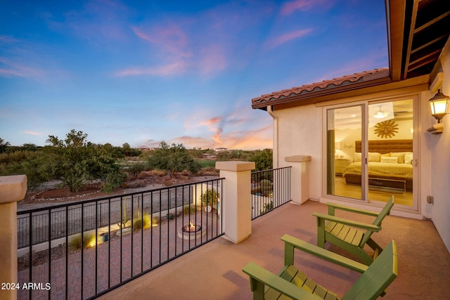 view of balcony at dusk