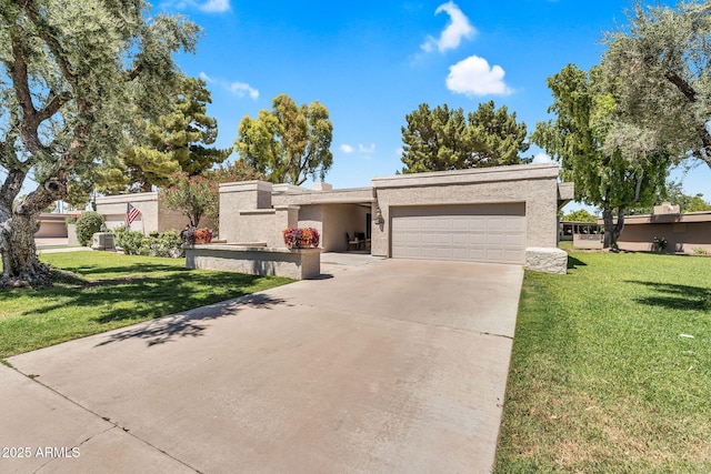 7832 E Via Marina, Scottsdale, AZ 85258 - view of front facade featuring a garage, concrete driveway, a front lawn, and stucco siding