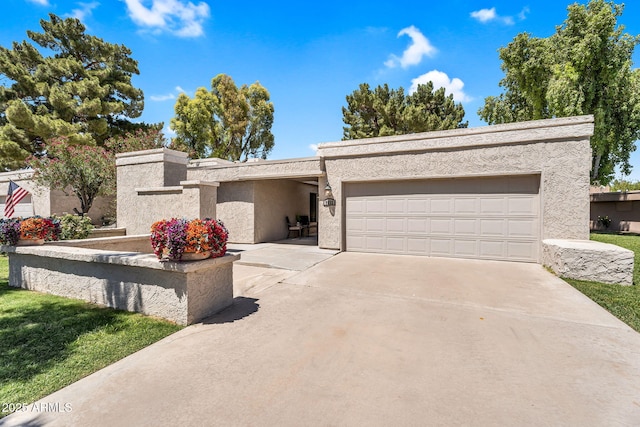 7832 E Via Marina, Scottsdale, AZ 85258 - view of front of house with a garage, driveway, and stucco siding