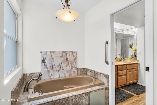 7832 E Via Marina, Scottsdale, AZ 85258 - full bath with vanity, a garden tub, and wood finished floors