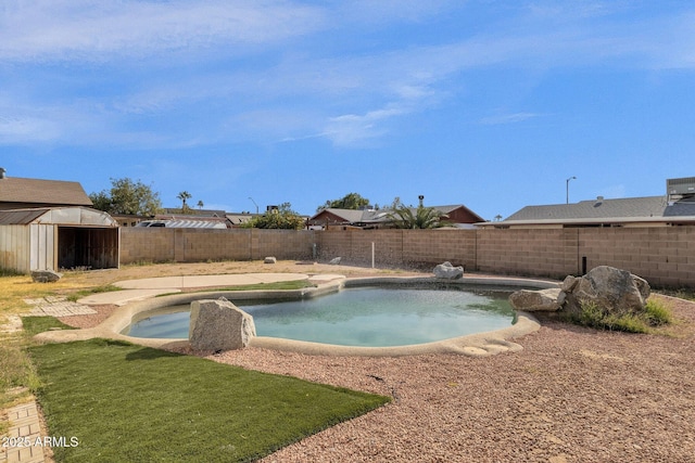 view of swimming pool featuring a storage unit