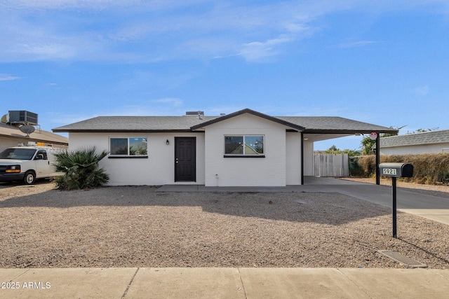 ranch-style home with a carport