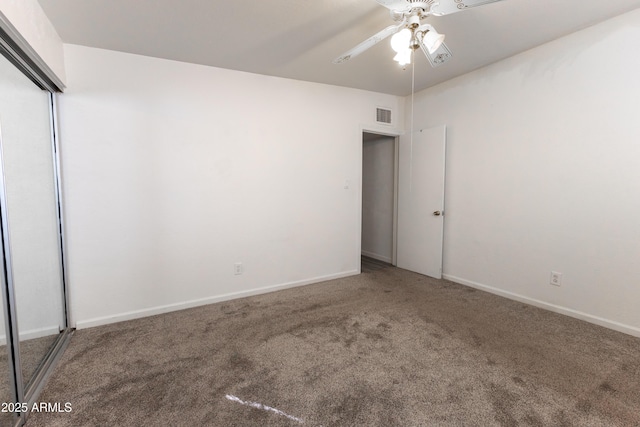 unfurnished room with baseboards, ceiling fan, visible vents, and carpet flooring