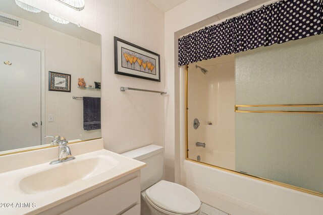 full bathroom with vanity, toilet, and washtub / shower combination