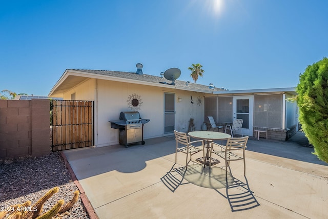 back of house with a patio area