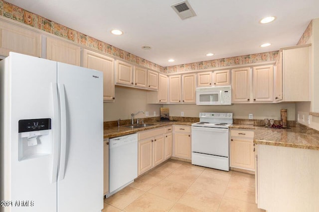 kitchen featuring visible vents, recessed lighting, white appliances, and a sink